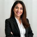 Fatima Al Suwaidi smiling, business attire